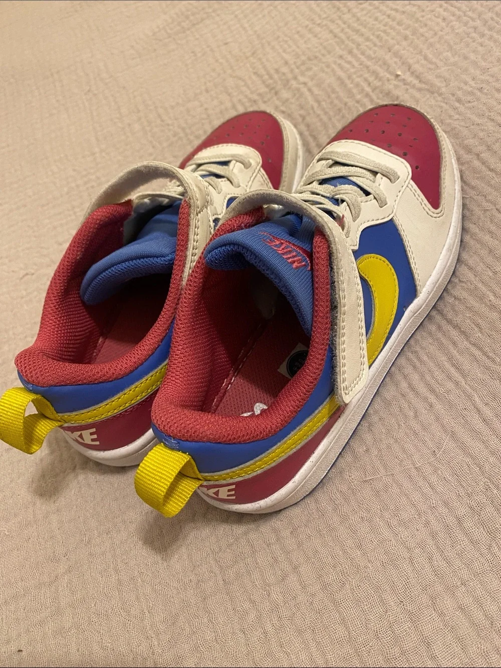 Nike Kids Low-Top Sneakers in White, Blue, Pink & Yellow. Size 13.5